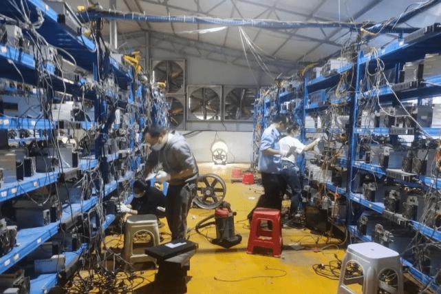 A bustling mining farm illuminated with rows of mining machines